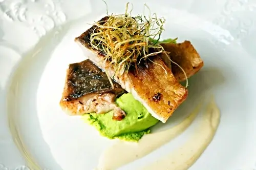 Butter-fried carp with pea purée and Riesling sauce